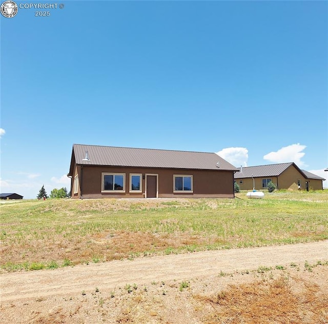 201 Fox Run, Silver Cliff, CO 81252 - view of front of home with a metal roof and stucco siding