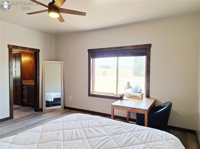 201 Fox Run, Silver Cliff, CO 81252 - bedroom featuring wood finished floors, connected bathroom, and ceiling fan