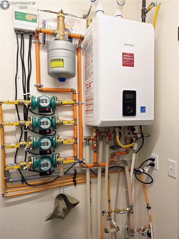 201 Fox Run, Silver Cliff, CO 81252 - utility room featuring water heater