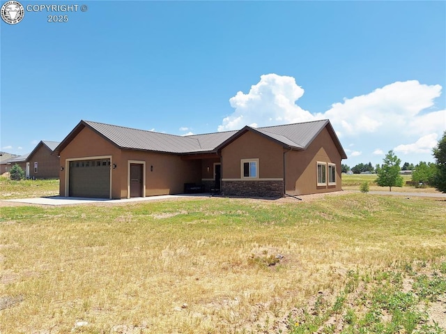 201 Fox Run, Silver Cliff, CO 81252 - ranch-style home with stucco siding, an attached garage, stone siding, a front lawn, and concrete driveway