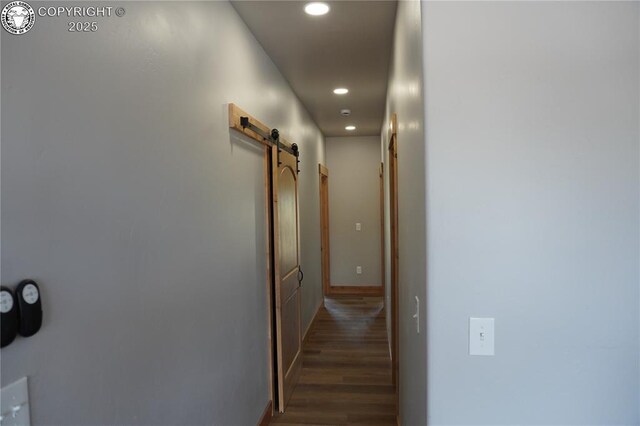 197 High Meadows Dr, Florence, CO 81226 - corridor with a barn door, wood finished floors, recessed lighting, and baseboards
