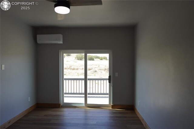 197 High Meadows Dr, Florence, CO 81226 - spare room with an AC wall unit, wood finished floors, baseboards, and a ceiling fan