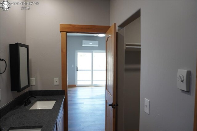 197 High Meadows Dr, Florence, CO 81226 - bathroom featuring double vanity and wood finished floors