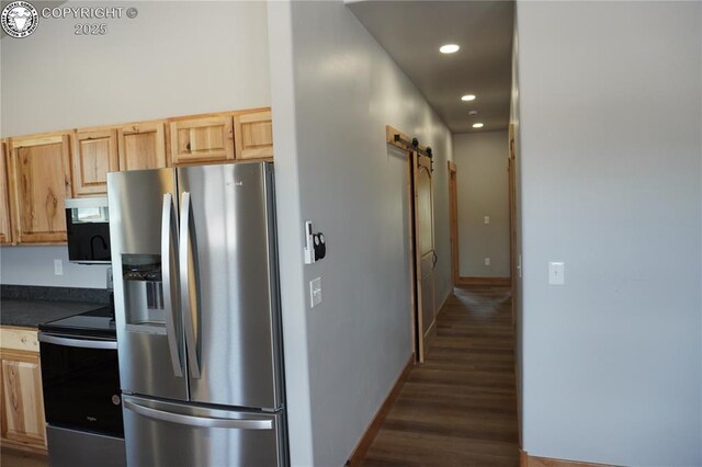 197 High Meadows Dr, Florence, CO 81226 - kitchen with stainless steel refrigerator with ice dispenser, range with electric stovetop, dark countertops, wood finished floors, and a barn door