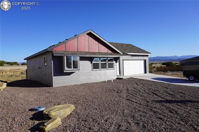197 High Meadows Dr, Florence, CO 81226 - view of front of home featuring a garage, concrete driveway, and a mountain view