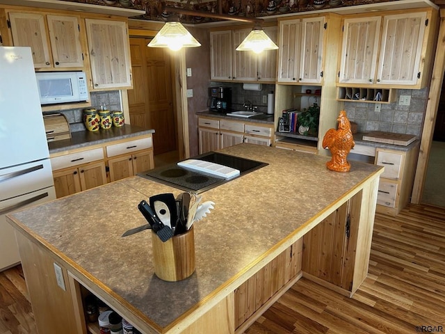 2 Inverness Ave, Westcliffe, CO 81252 - kitchen featuring white appliances, backsplash, wood finished floors, open shelves, and a kitchen island