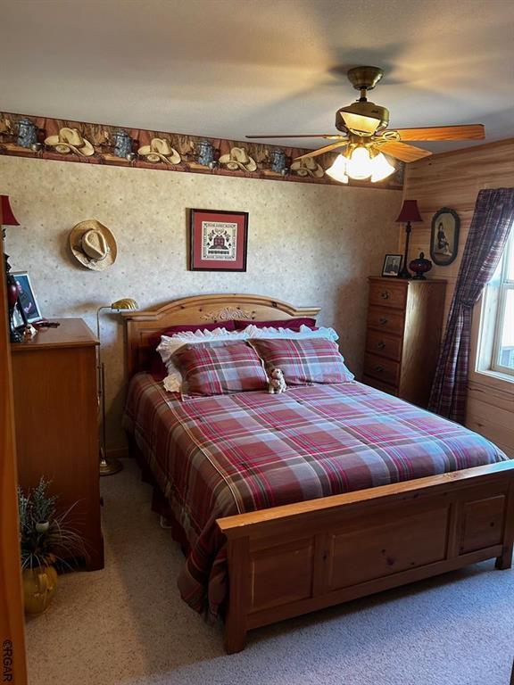 2 Inverness Ave, Westcliffe, CO 81252 - bedroom with light colored carpet and ceiling fan
