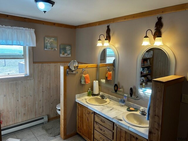 2 Inverness Ave, Westcliffe, CO 81252 - full bathroom with a baseboard heating unit, wood walls, toilet, double vanity, and wainscoting