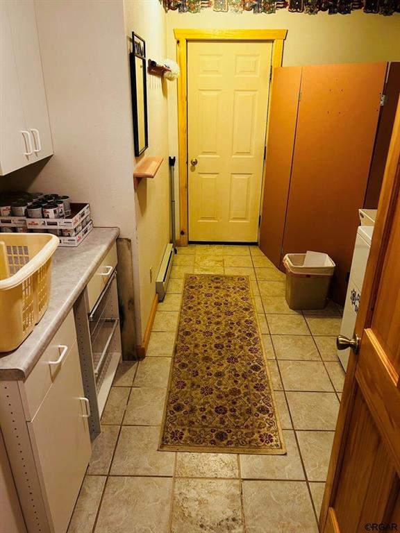 2 Inverness Ave, Westcliffe, CO 81252 - entryway with a baseboard radiator and light tile patterned floors