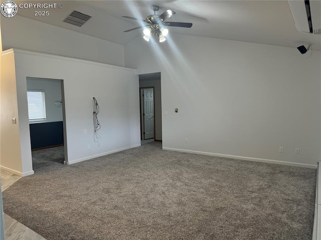 5 Cory Ln, Florence, CO 81226 - carpeted empty room with vaulted ceiling, visible vents, baseboards, and a ceiling fan