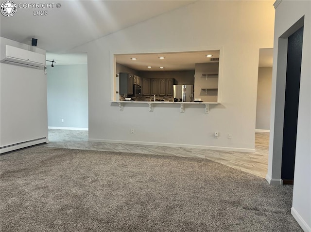 5 Cory Ln, Florence, CO 81226 - unfurnished living room with lofted ceiling, light colored carpet, recessed lighting, a wall mounted AC, and baseboards