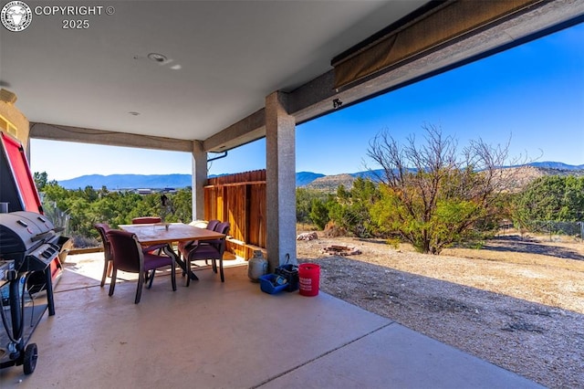 5 Cory Ln, Florence, CO 81226 - view of patio featuring a grill, outdoor dining area, and a mountain view