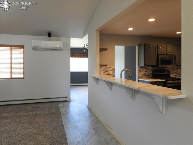 kitchen with backsplash and stainless steel appliances