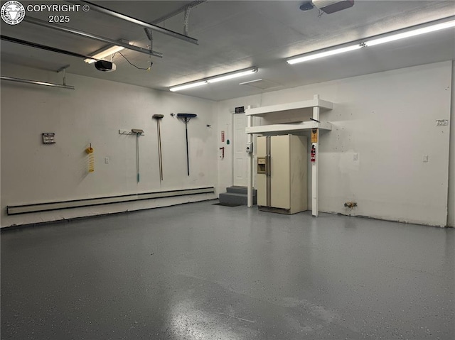 5 Cory Ln, Florence, CO 81226 - garage featuring a garage door opener, baseboard heating, and white fridge with ice dispenser
