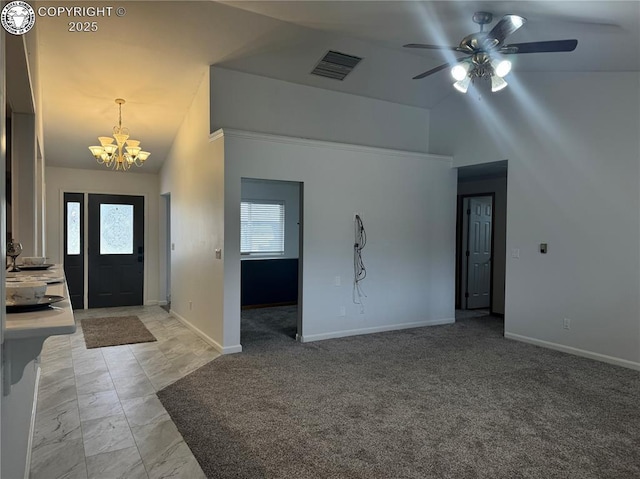 5 Cory Ln, Florence, CO 81226 - entryway featuring ceiling fan with notable chandelier, high vaulted ceiling, visible vents, baseboards, and light carpet