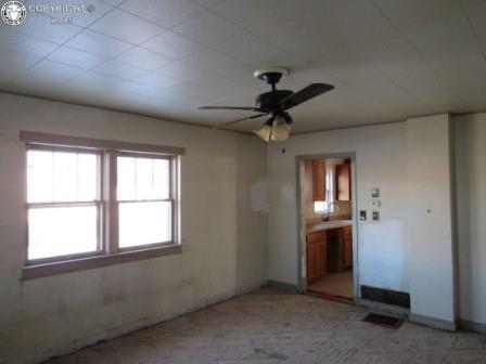 spare room with ceiling fan