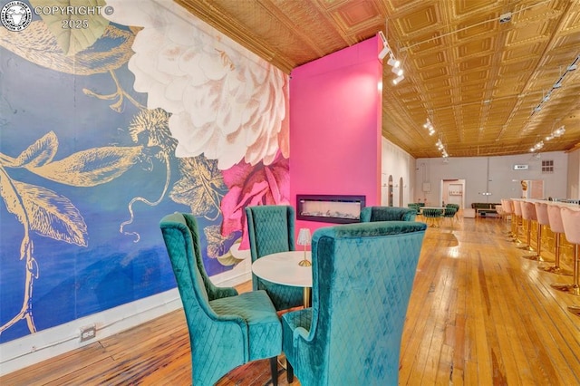 122 W Main St, Florence, CO 81226 - dining area featuring wood-type flooring and an ornate ceiling