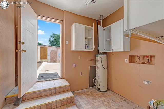 122 W Main St, Florence, CO 81226 - washroom featuring gas water heater and hookup for a washing machine