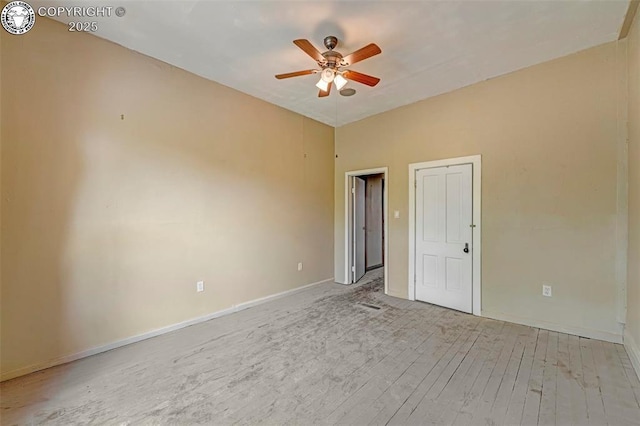 122 W Main St, Florence, CO 81226 - spare room featuring a ceiling fan, baseboards, and light wood finished floors