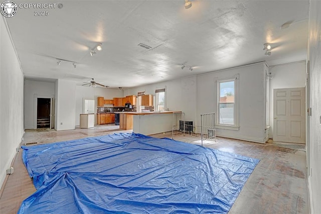 122 W Main St, Florence, CO 81226 - bedroom featuring rail lighting and baseboards