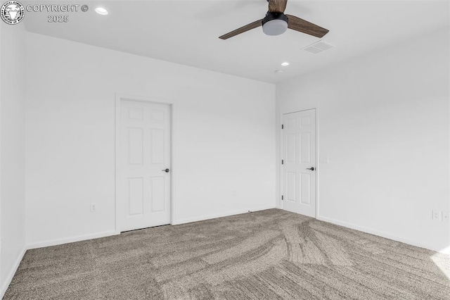 carpeted empty room with ceiling fan