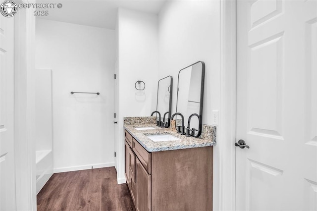 bathroom featuring hardwood / wood-style flooring and vanity