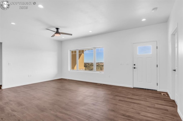 entrance foyer with dark wood-type flooring and ceiling fan