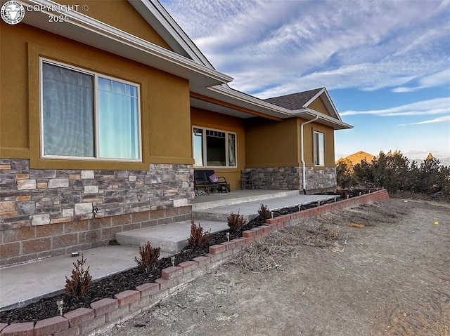 view of side of home featuring a patio area