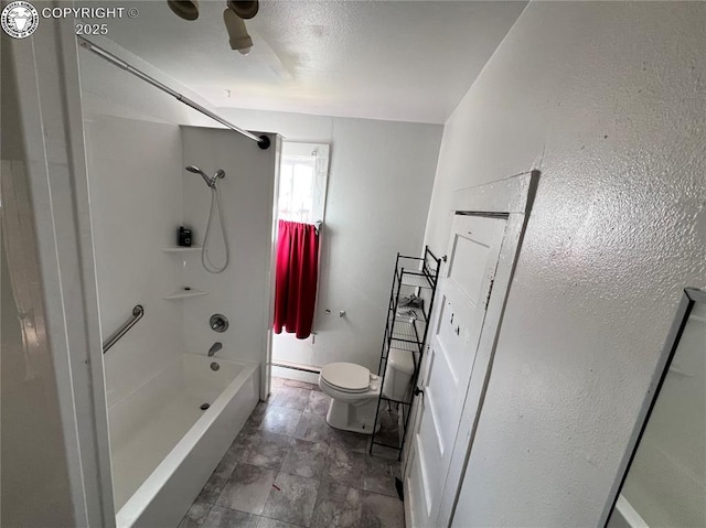 bathroom featuring shower / bathtub combination and toilet