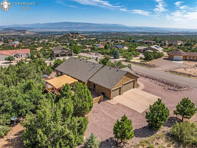 birds eye view of property with a mountain view