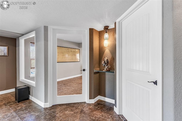 interior space with a textured ceiling