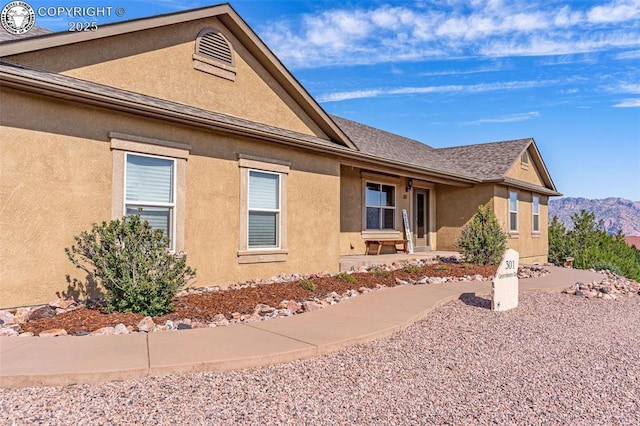 view of side of property featuring a mountain view