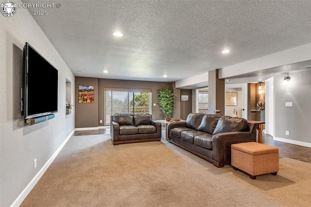 carpeted living room featuring built in features and a textured ceiling