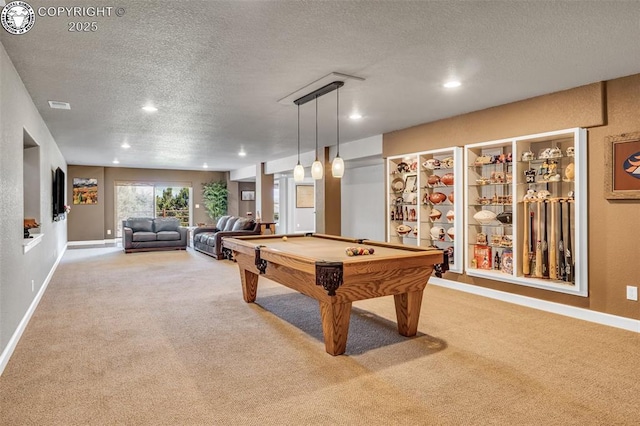 rec room featuring pool table, carpet, and a textured ceiling