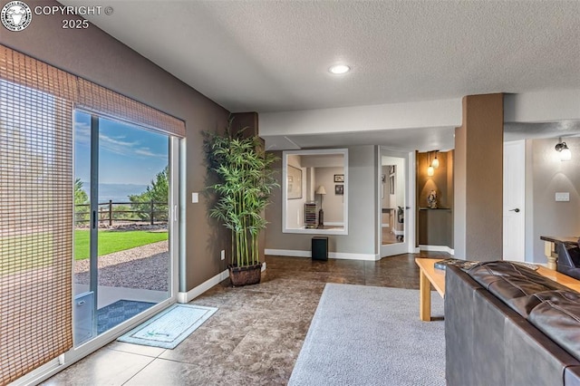 entryway featuring a textured ceiling