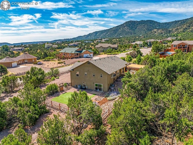 birds eye view of property with a mountain view