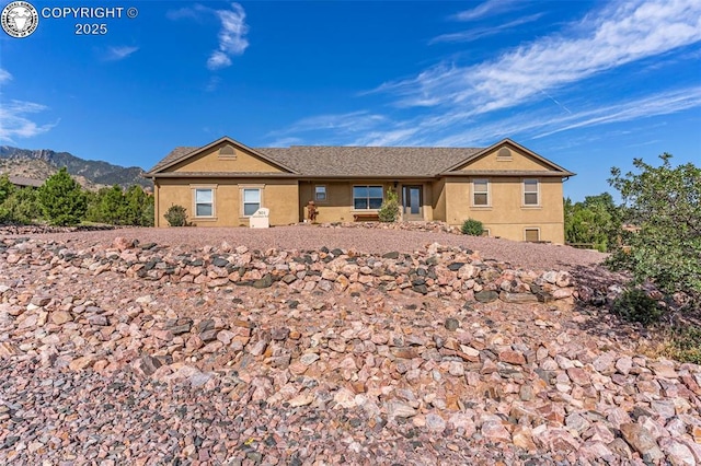 ranch-style home featuring a mountain view