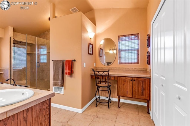 bathroom featuring walk in shower, vaulted ceiling, vanity, a healthy amount of sunlight, and tile patterned flooring