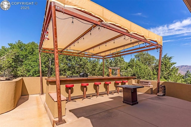 view of patio with an outdoor fire pit