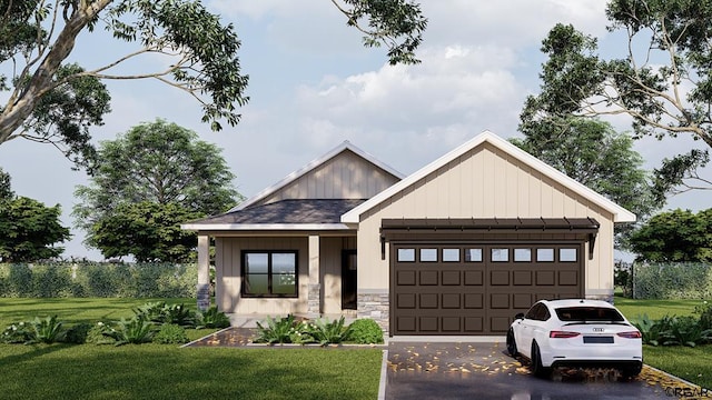 view of front of house with a garage and a front lawn