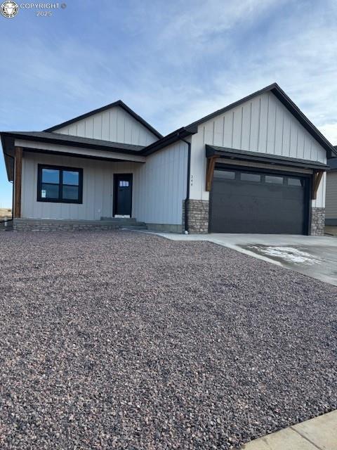 view of front of property with a garage and a front yard