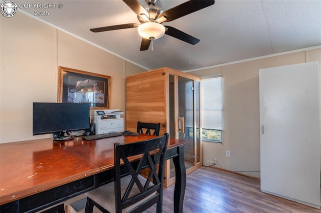 home office featuring crown molding, ceiling fan, and hardwood / wood-style flooring