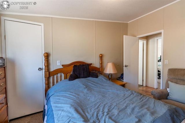 carpeted bedroom featuring ornamental molding