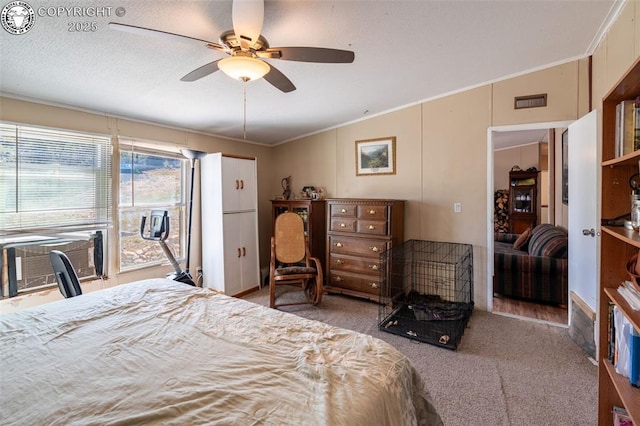 bedroom with ornamental molding, carpet floors, cooling unit, and ceiling fan