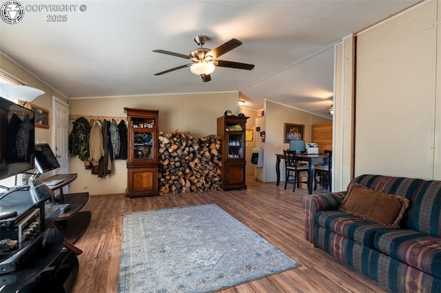 living room featuring hardwood / wood-style flooring, lofted ceiling, and ceiling fan