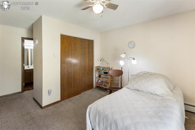1125 Barr Ave, Canon City, CO 81212 - bedroom featuring carpet flooring, a closet, a ceiling fan, and a baseboard heating unit
