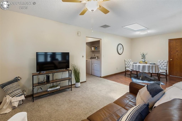 1125 Barr Ave, Canon City, CO 81212 - carpeted living area with washer and clothes dryer and ceiling fan