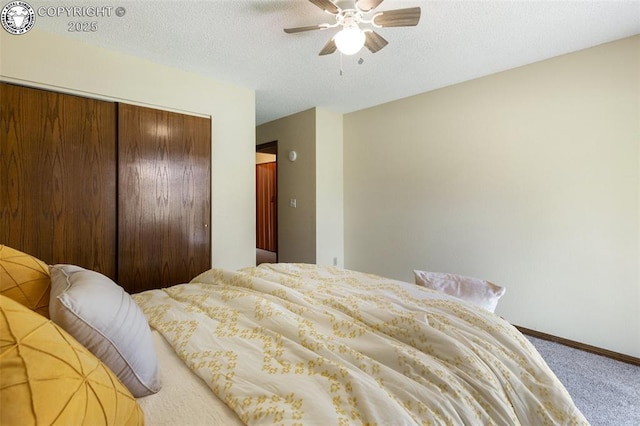 1125 Barr Ave, Canon City, CO 81212 - carpeted bedroom with a closet, ceiling fan, and a textured ceiling