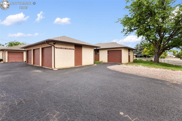 1125 Barr Ave, Canon City, CO 81212 - view of front of property with community garages and stucco siding
