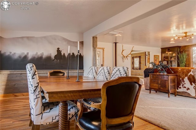 dining space featuring wood finished floors